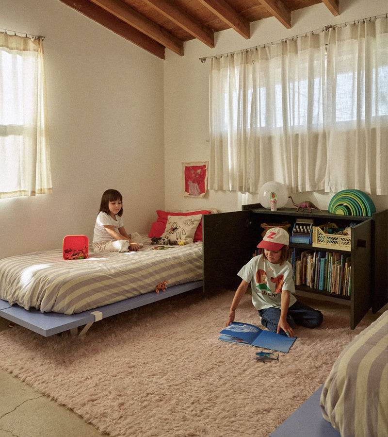 Children play in their bedroom, featuring The Floyd Bed in Color.